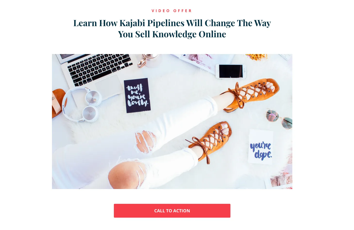 Kajabi landing page with an image of a person’s legs and office equipment above a fuchsia call to action button