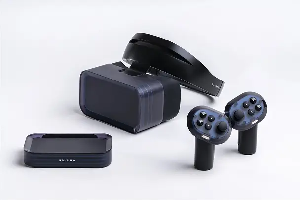 Black VR headset, two handheld controllers, a base station, and a wireless device all labelled Sakura on a white background.