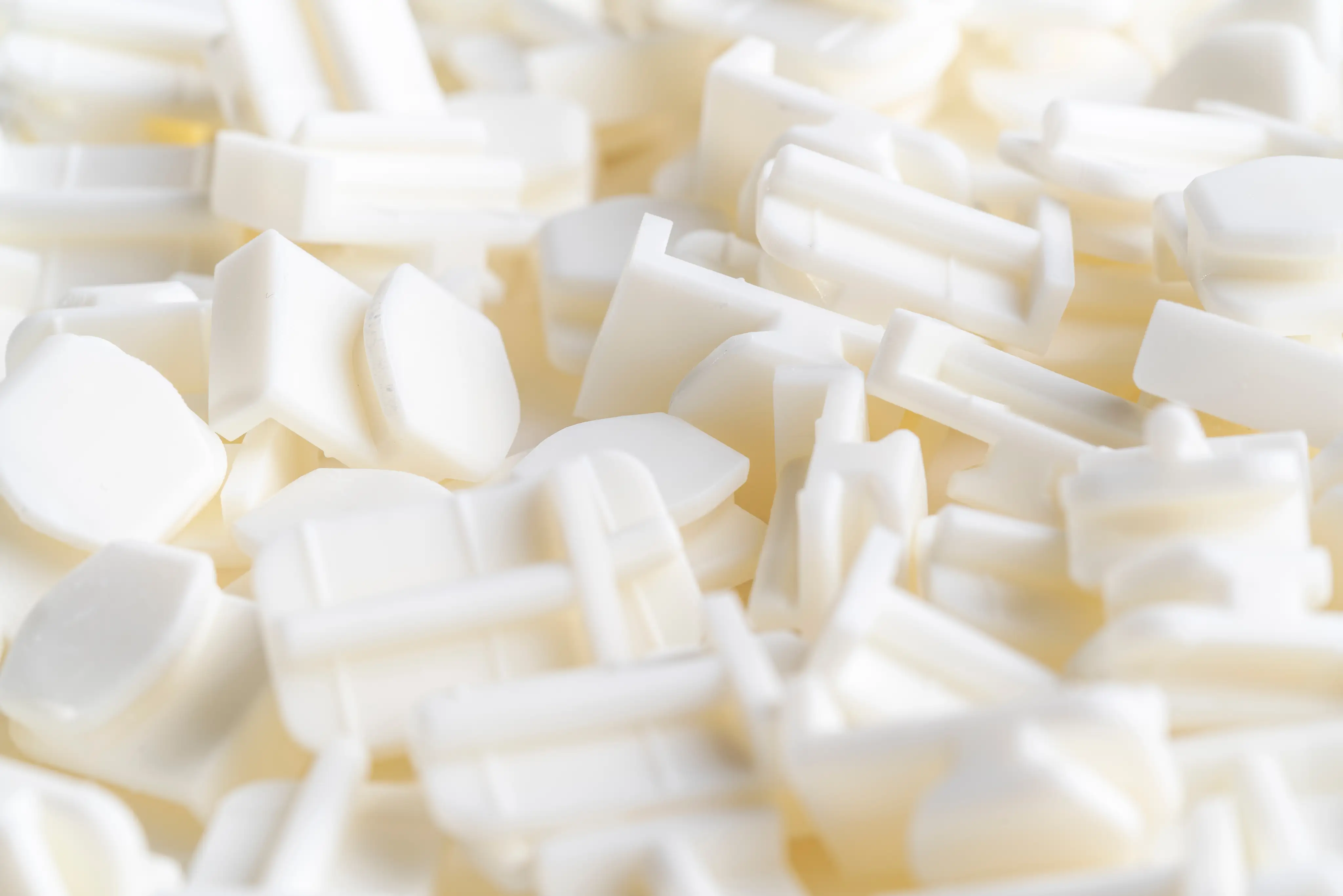 Close-up view of white plastic SLA parts printed 