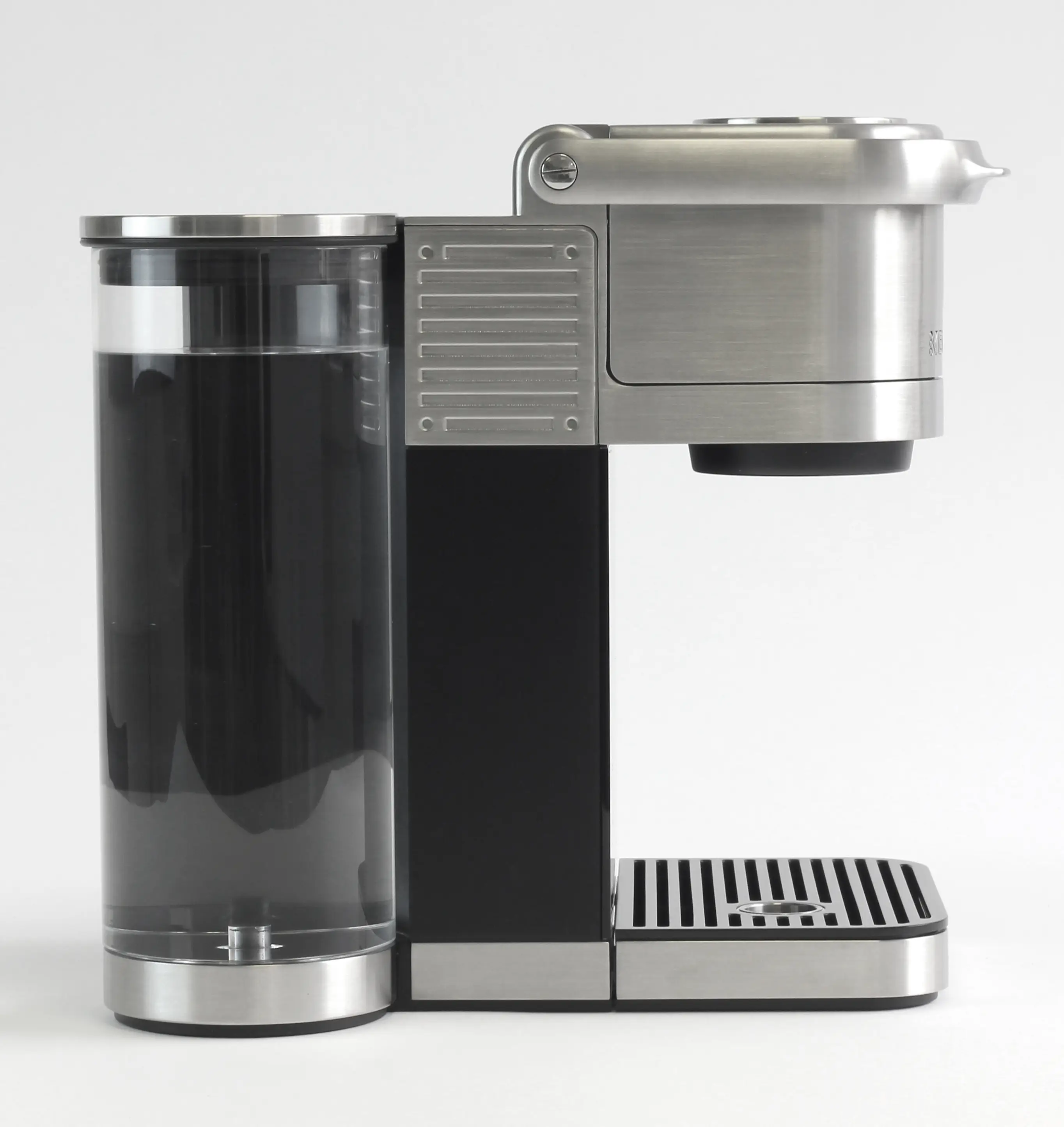 Modern single-serve espresso machine with stainless steel and black design.