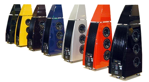 Seven Meridian 7K painted, uniquely shaped speakers arranged in a row against a white background.