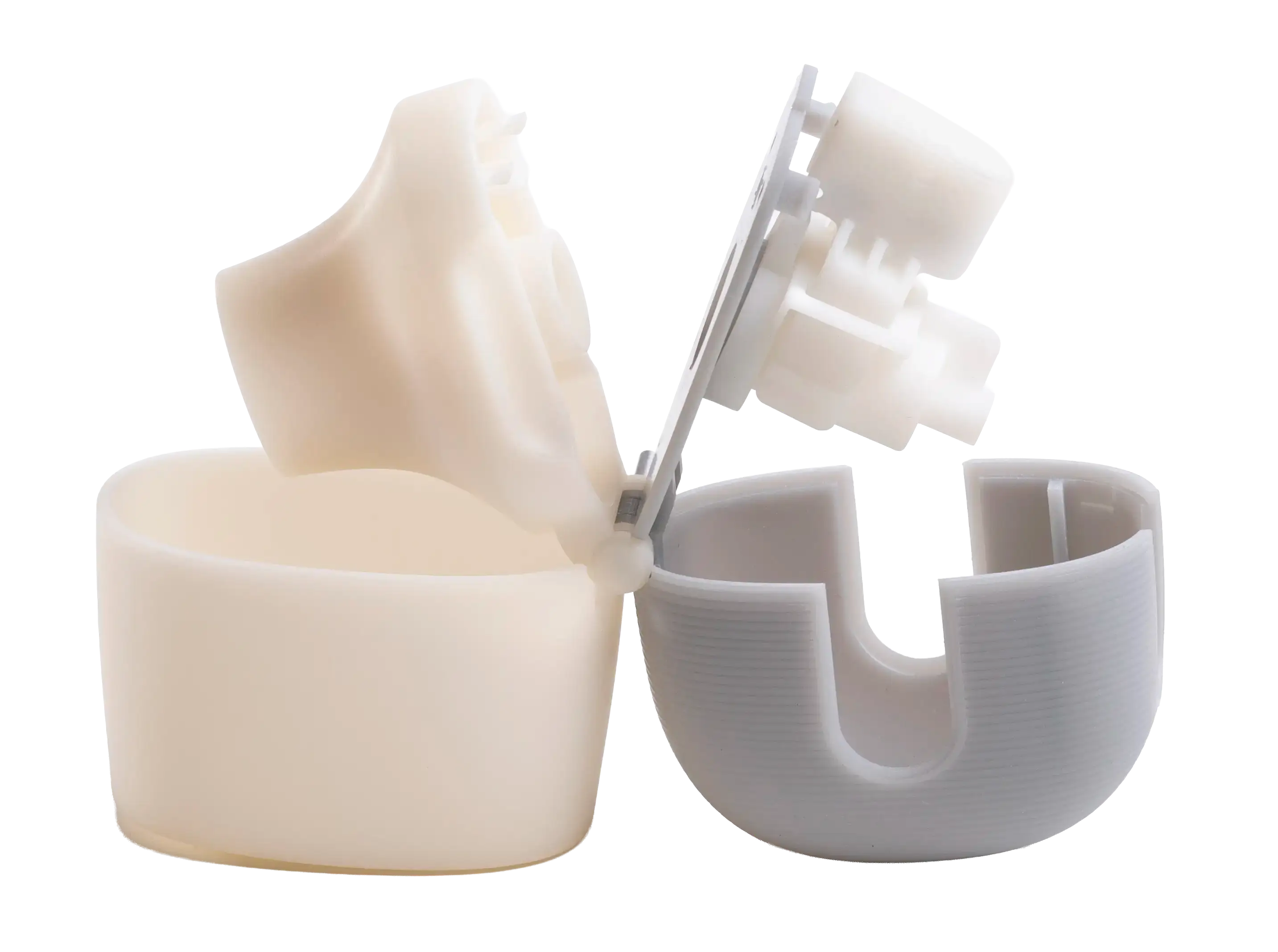 prototype inhaler  with extreme grey and rapid white parts connected by a hinge, showing internal components.