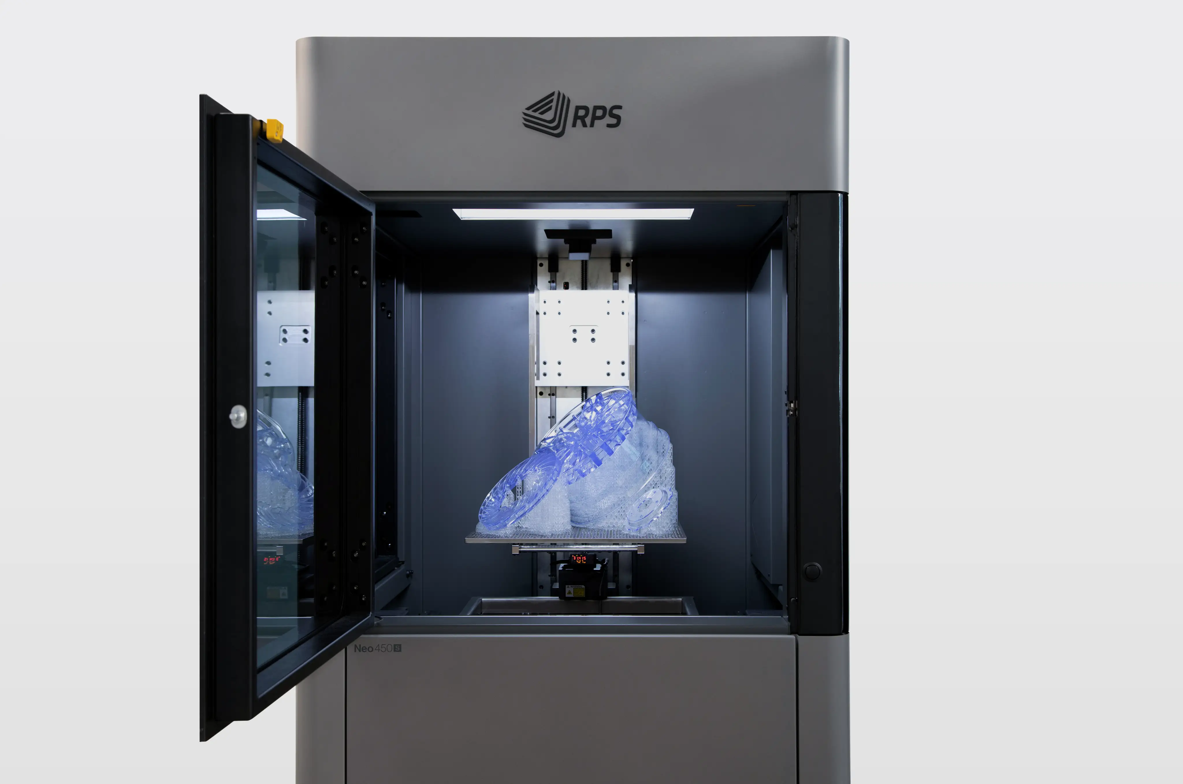 Open RPS Neo 450 S 3D printer with blue translucent object being printed inside.