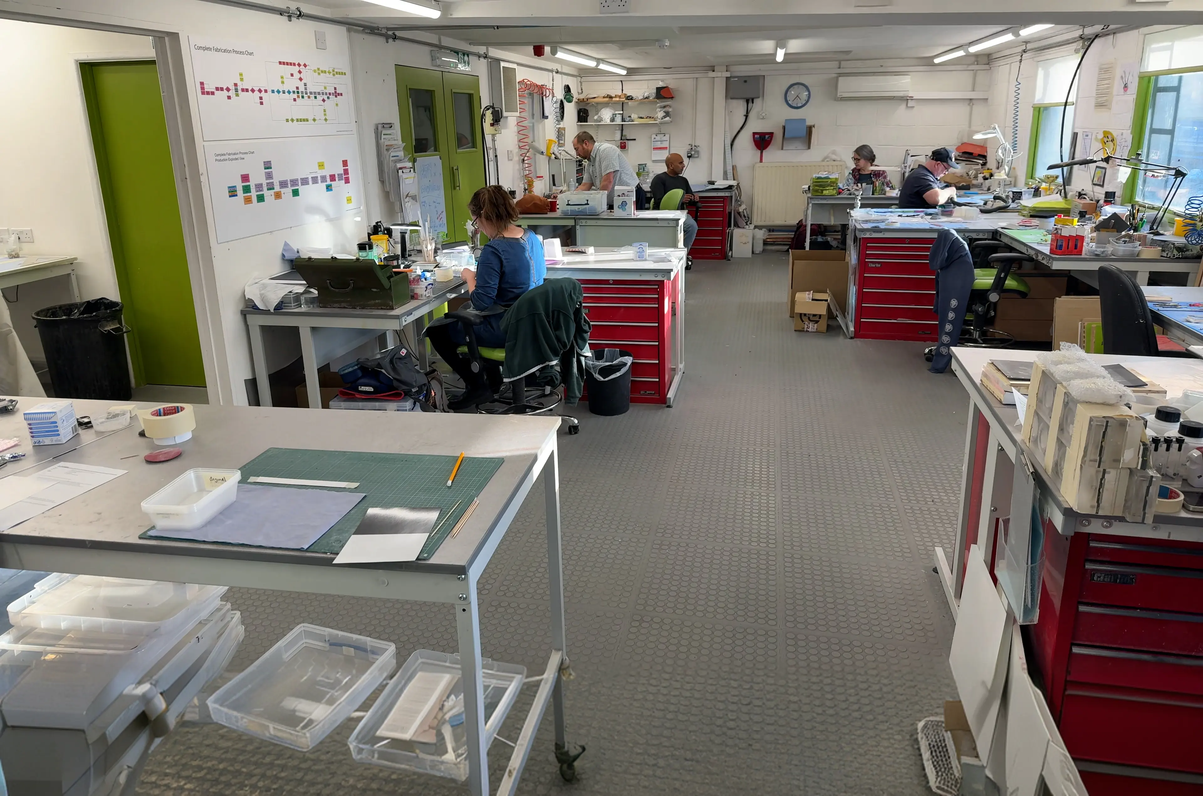 rapid prototype workshop desks with employees 
