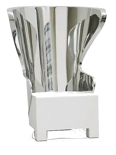 Abstract shiny silver sculpture with reflective surfaces on a white rectangular base.