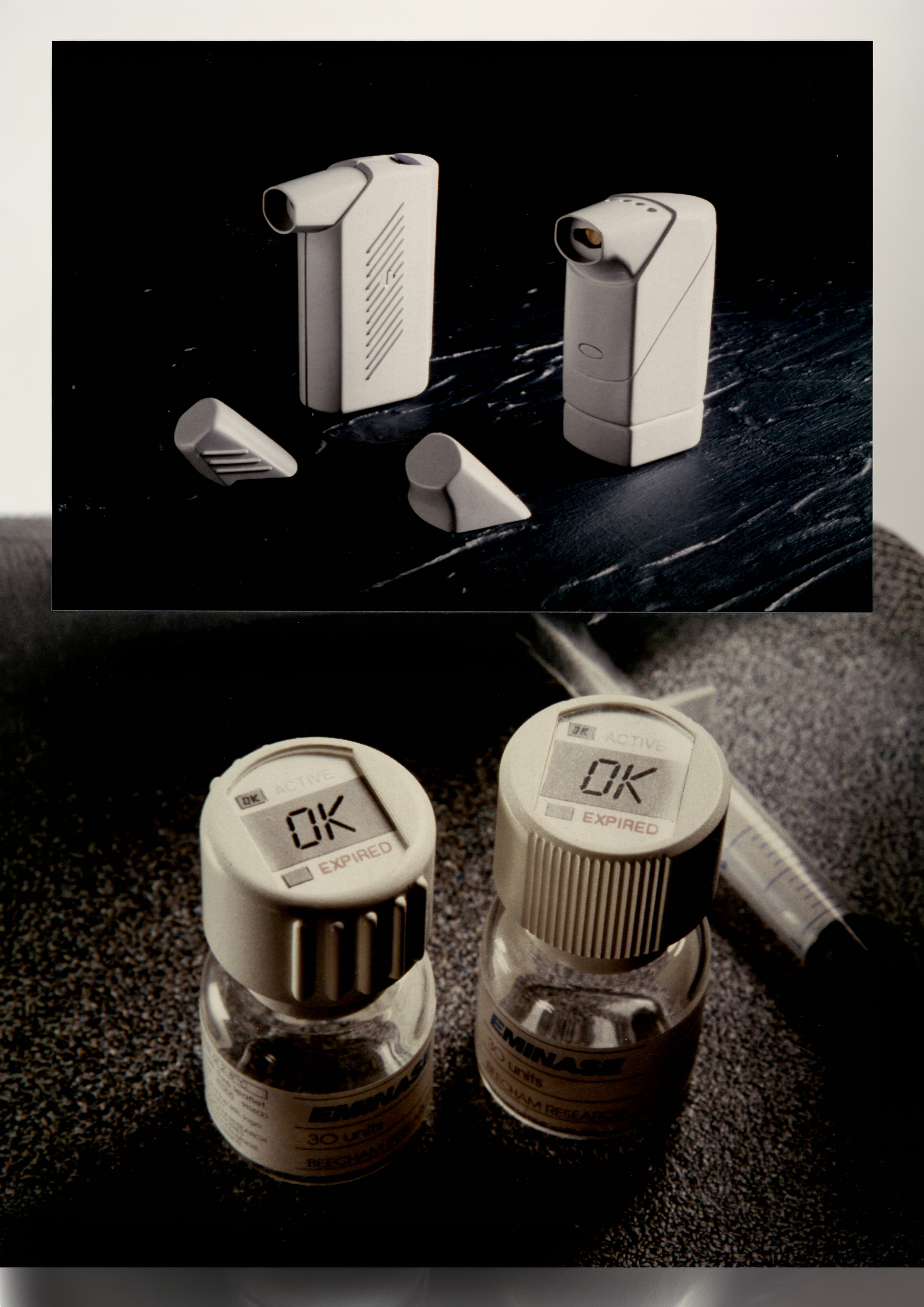 Two small medical vials labelled Eminase with digital caps displaying status indicators reading OK and EXPIRED, placed on a dark surface near a syringe, with an inset image above showing two white handheld inhalers and their detachable mouthpieces on a black surface.
