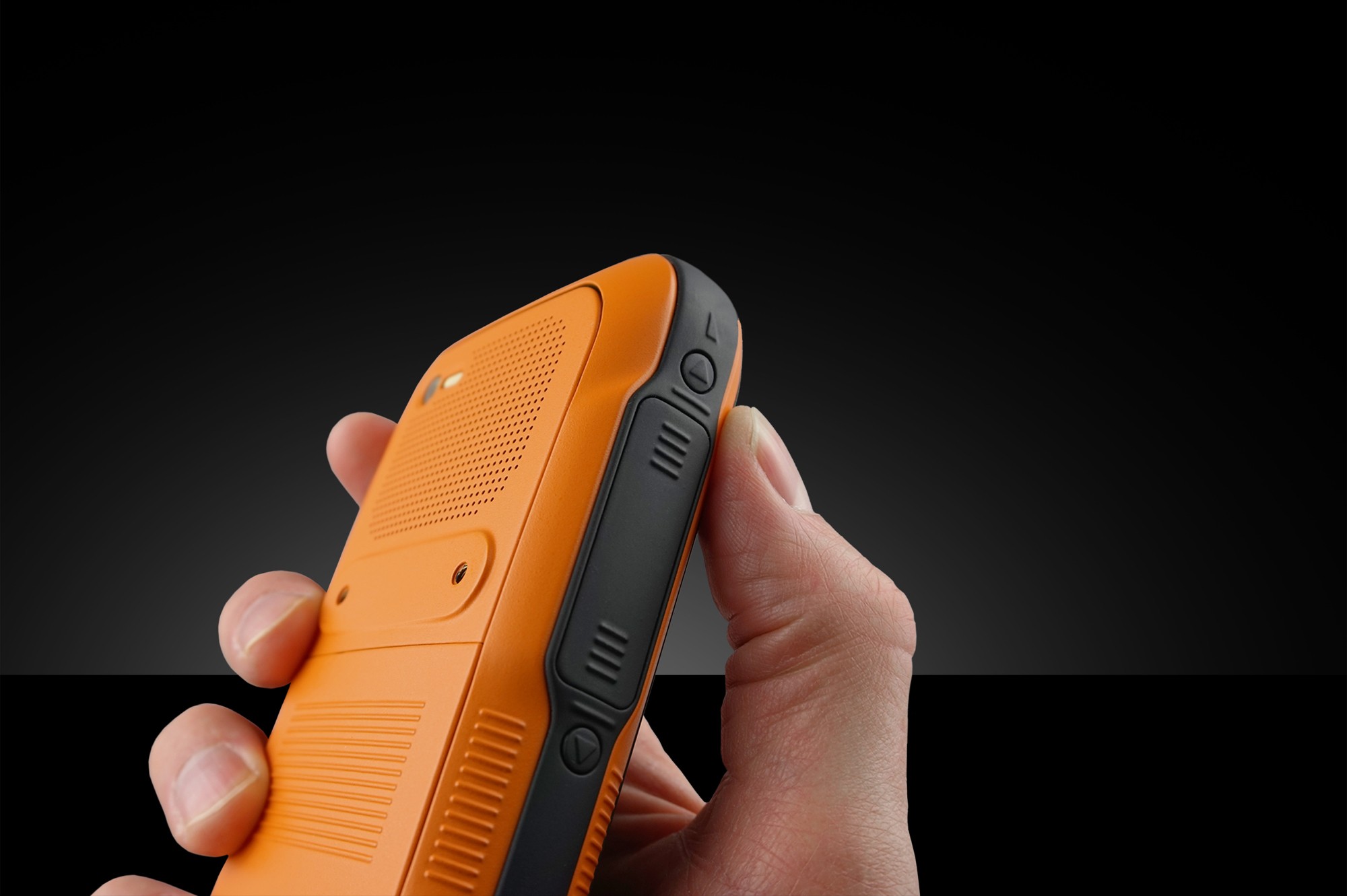 Hand holding the orange Blackfin Mobile model