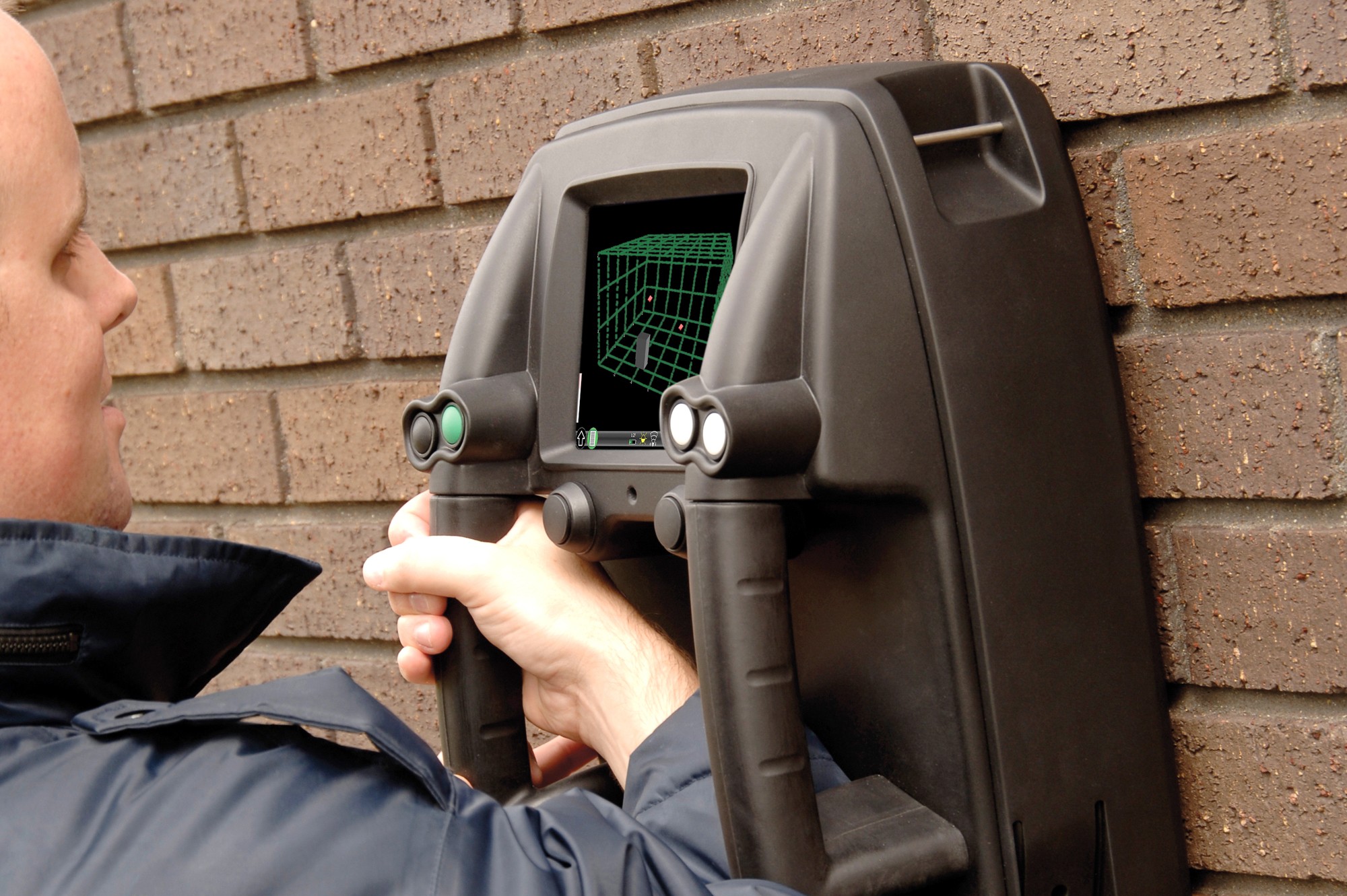 Operator holding a Prism200 unit with vacuum-cast case works