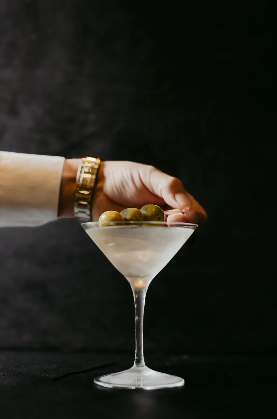 Gin Martini being prepared with Olives