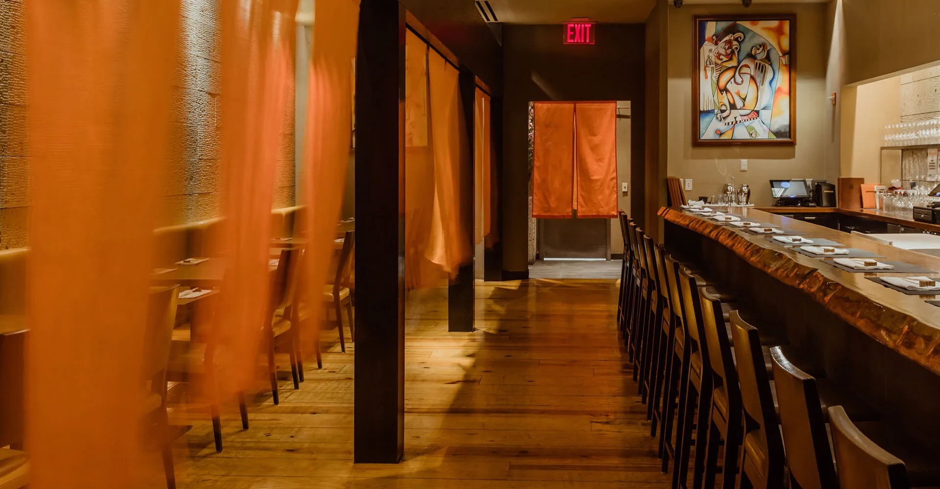 A wide shot of Bar Masa, featuring the bar and the dining area