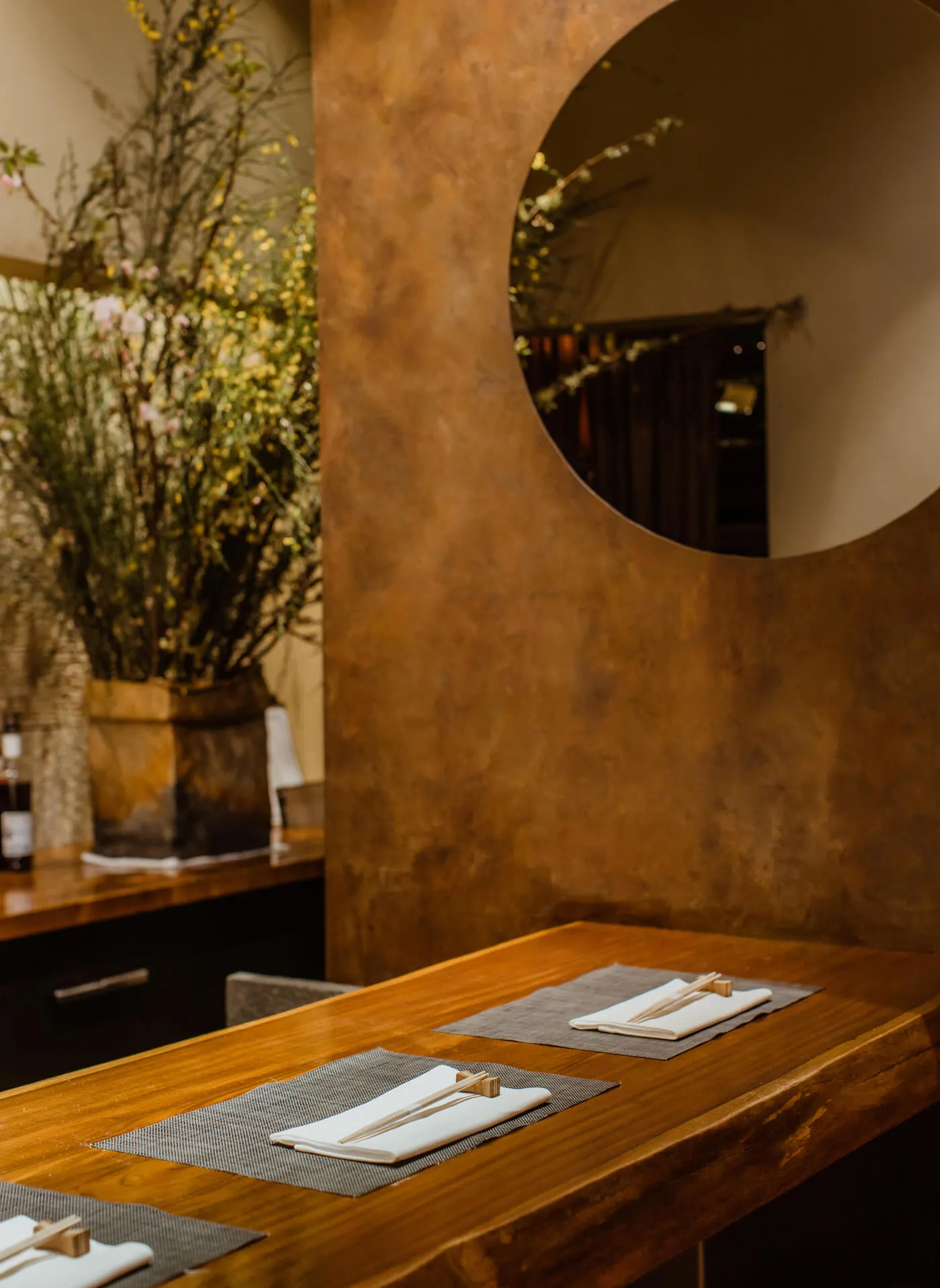 The end of the bar, featuring the circular hanging wall mirror