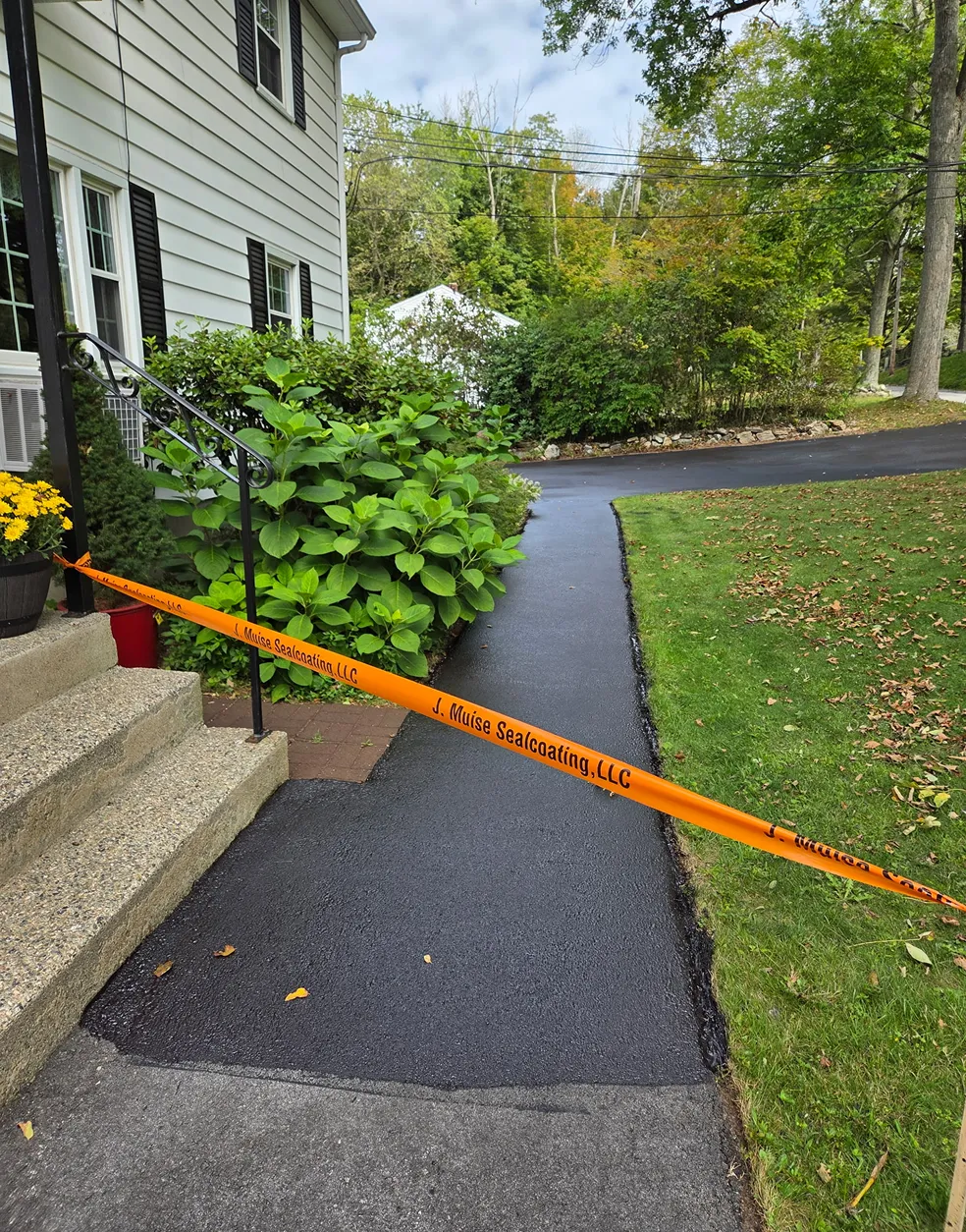 Sealcoating of paved walkway