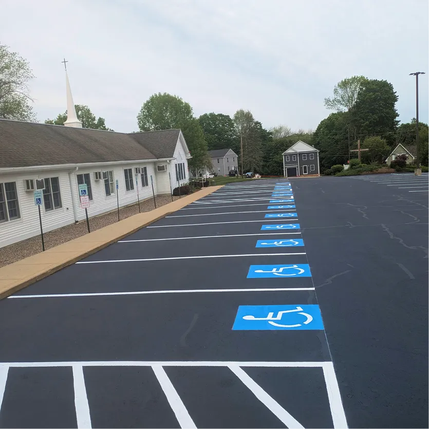 Commercial driveway seal coated and line striped