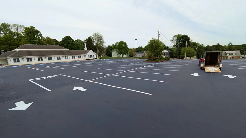 Commercial driveway freshly seal coated and line striped