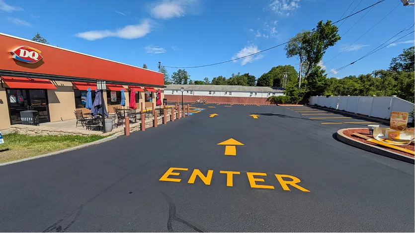 Commercial driveway freshly seal coated and line striped