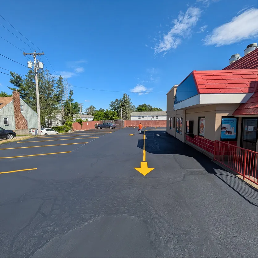 Commercial driveway freshly seal coated and line striped