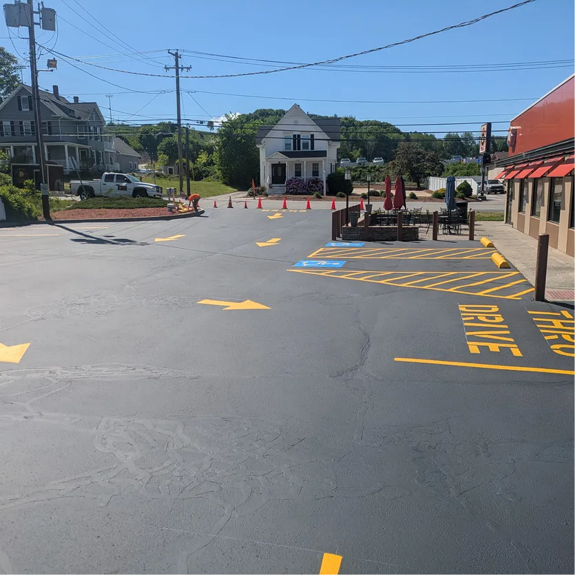 Commercial driveway freshly seal coated and line striped