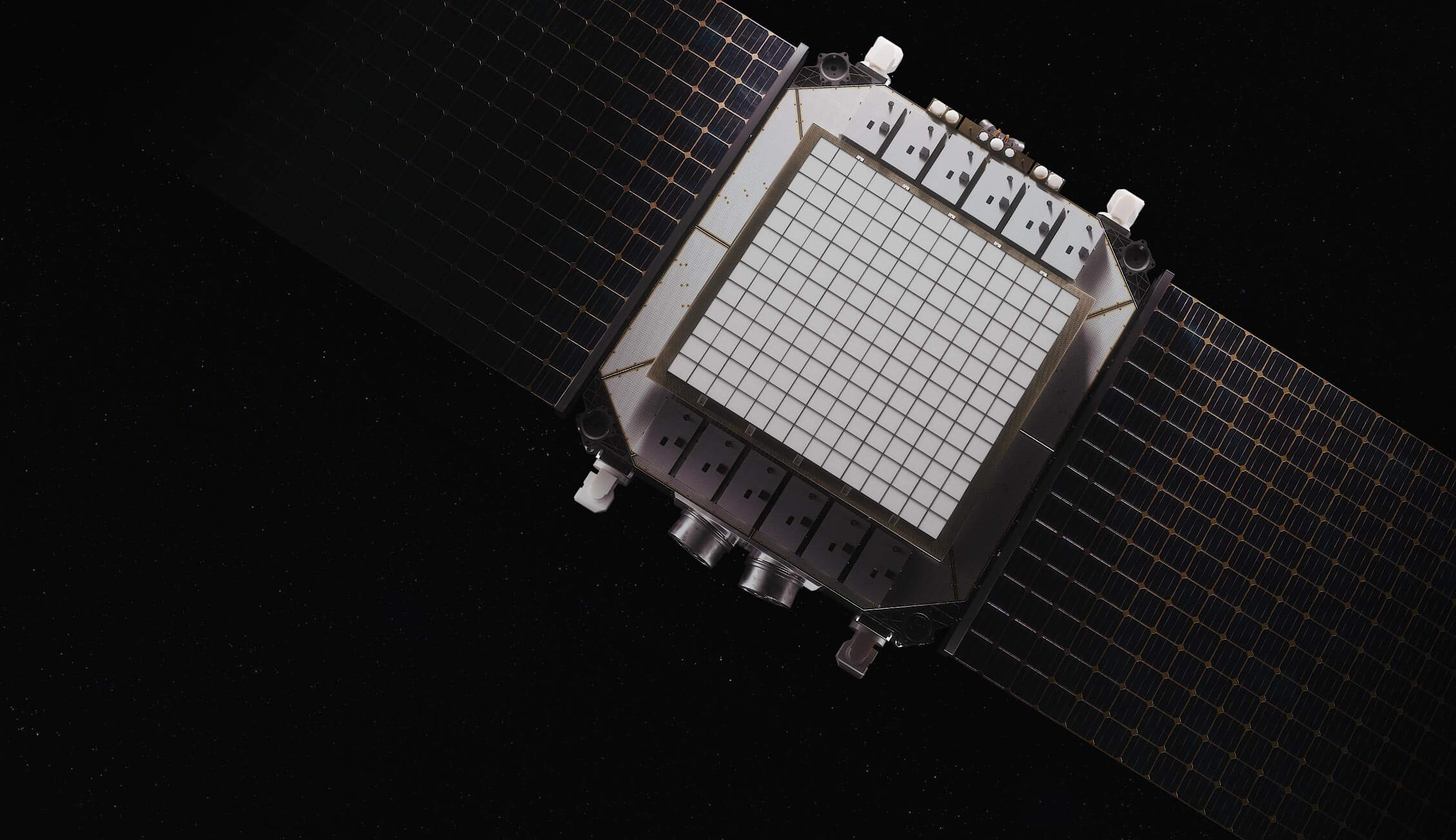 Engineers working inside the K2 Space manufacturing facility, assembling satellite components behind large glass panels