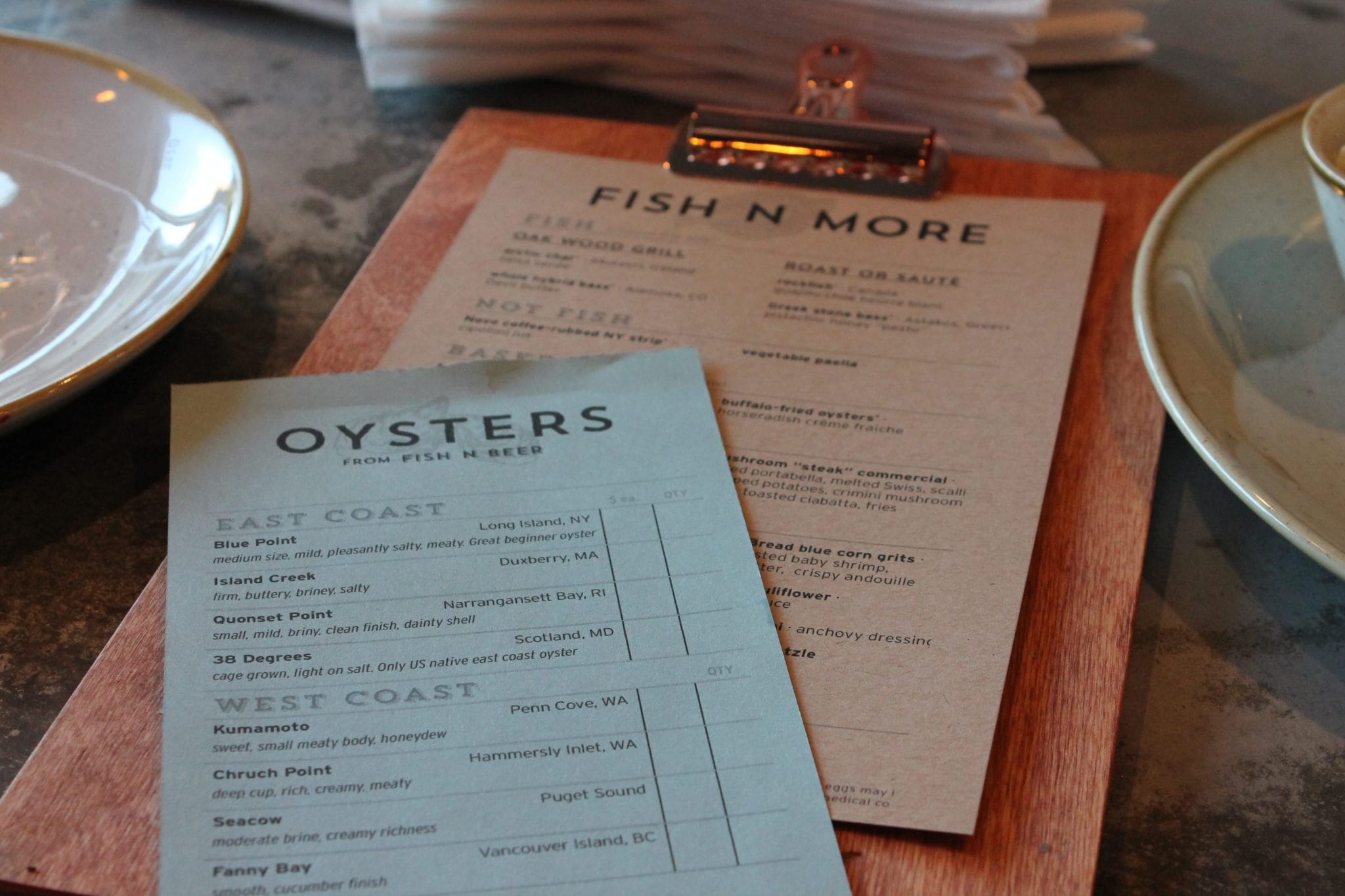 Fish N Beer Oyster menu on a table