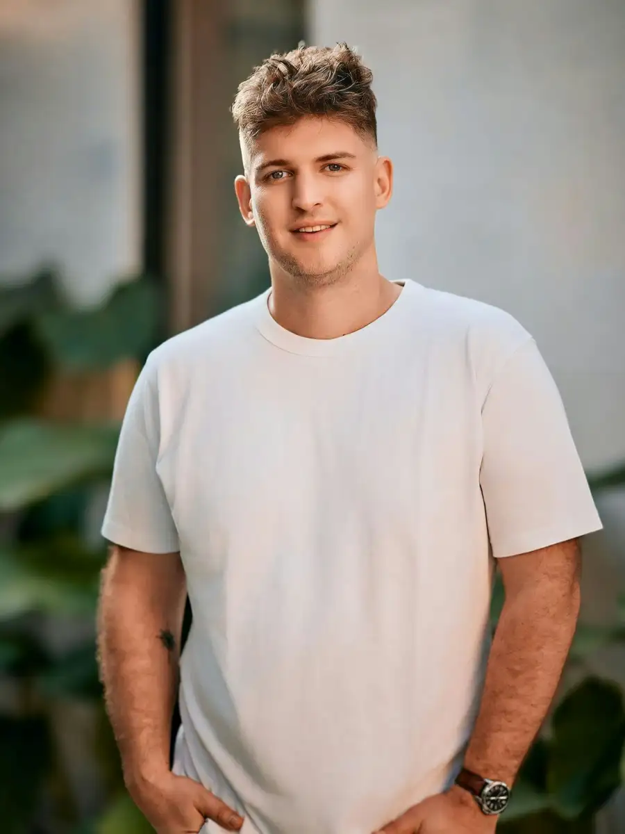 Portrait of a man wearing a white t-shirt