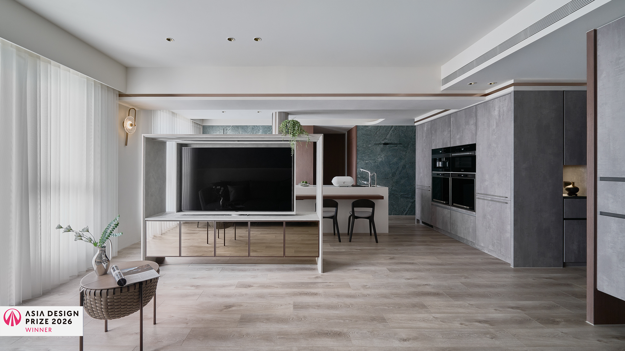 Modern open-plan living room and kitchen with wood flooring, large TV on mirrored cabinet, and dining area with two chairs.