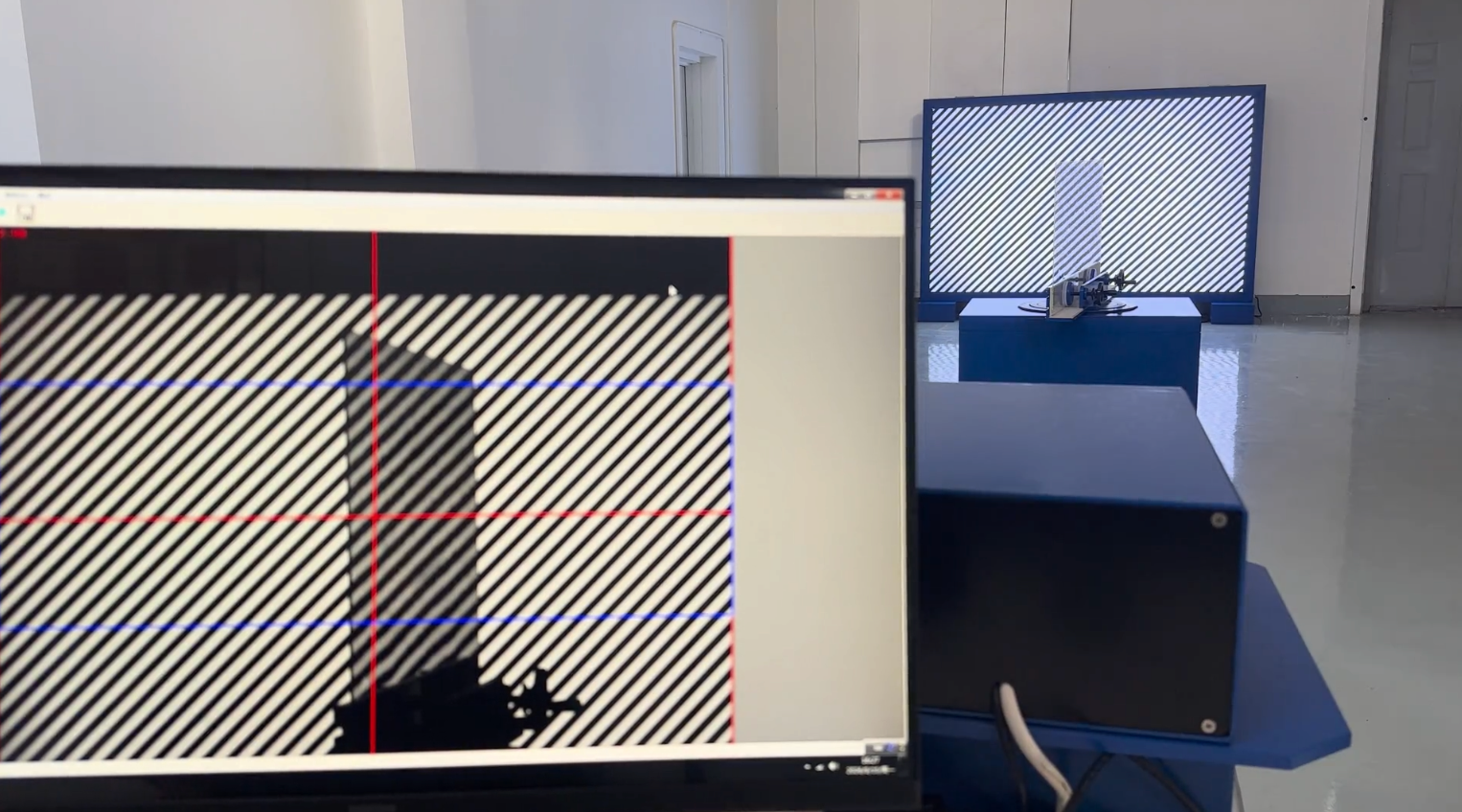 FZT-2 measurement setup showing monitor, camera unit, glass sample and zebra board