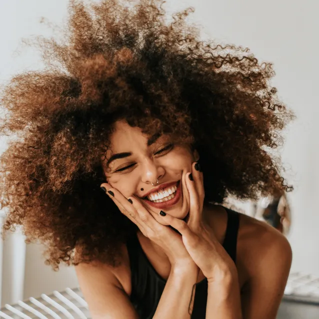 Confident adult smiling after orthodontic treatment