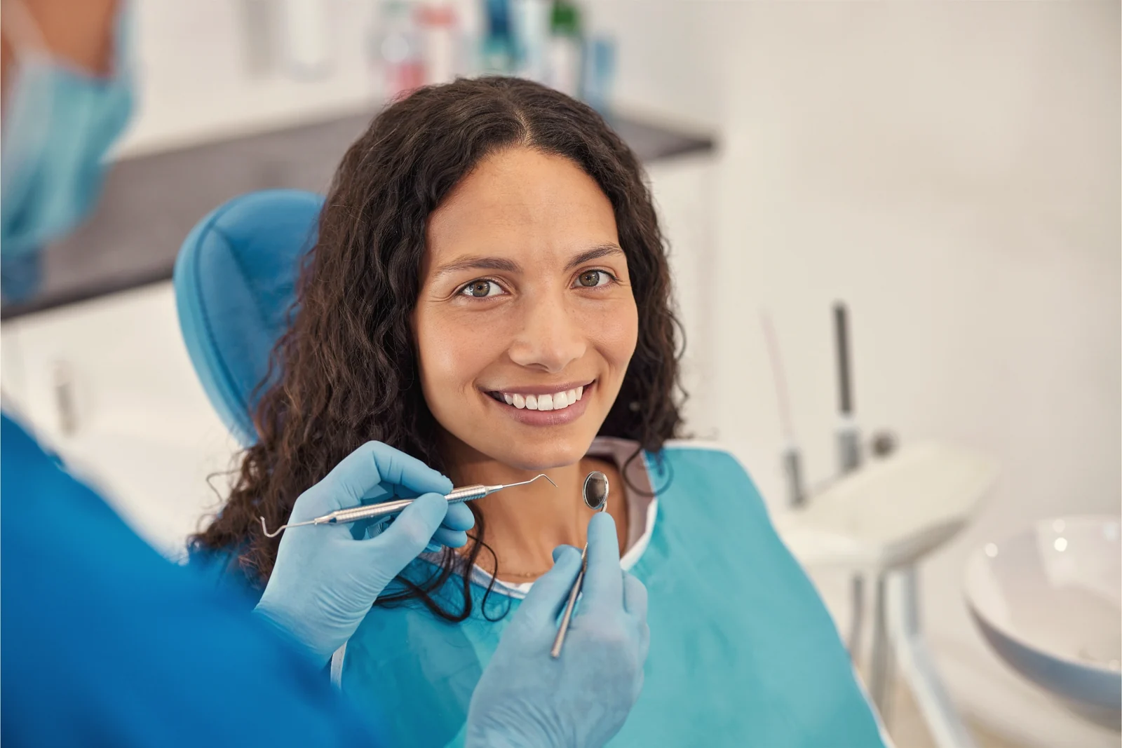 Adult woman smiling in the chair during her treatment