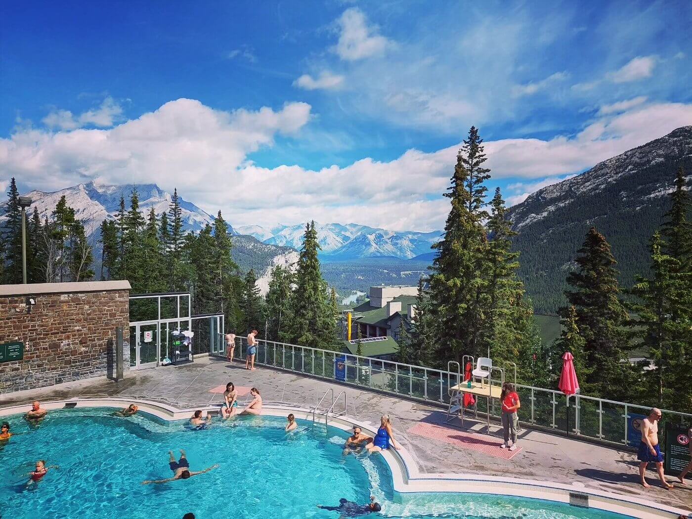 Banff Upper Hot Springs outdoor pool with snow-capped mountain backdrop, the most visited hot spring in Canada
