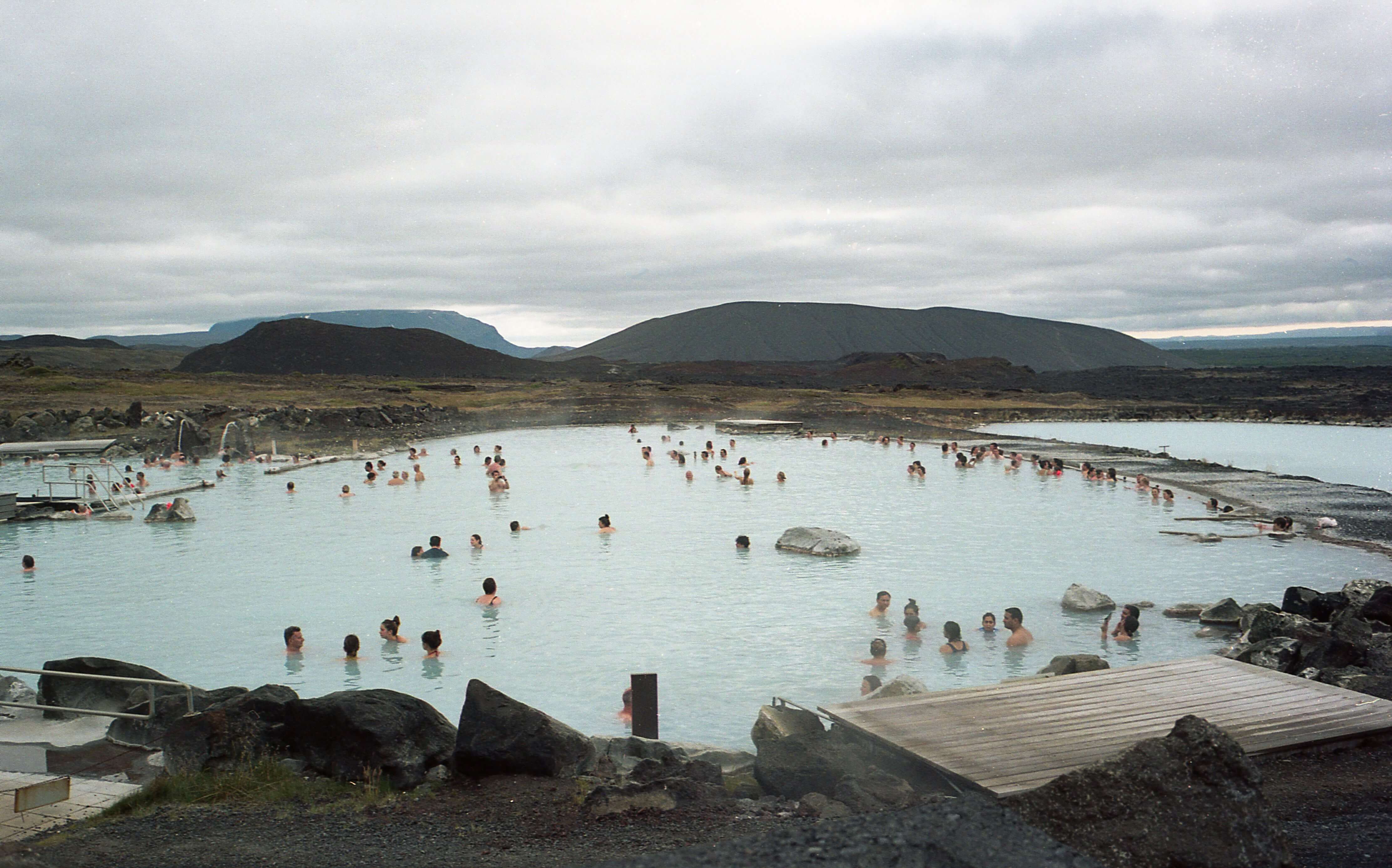 People soaking at the Blue Lagoon in Iceland, one of the best places for hot springs in the world