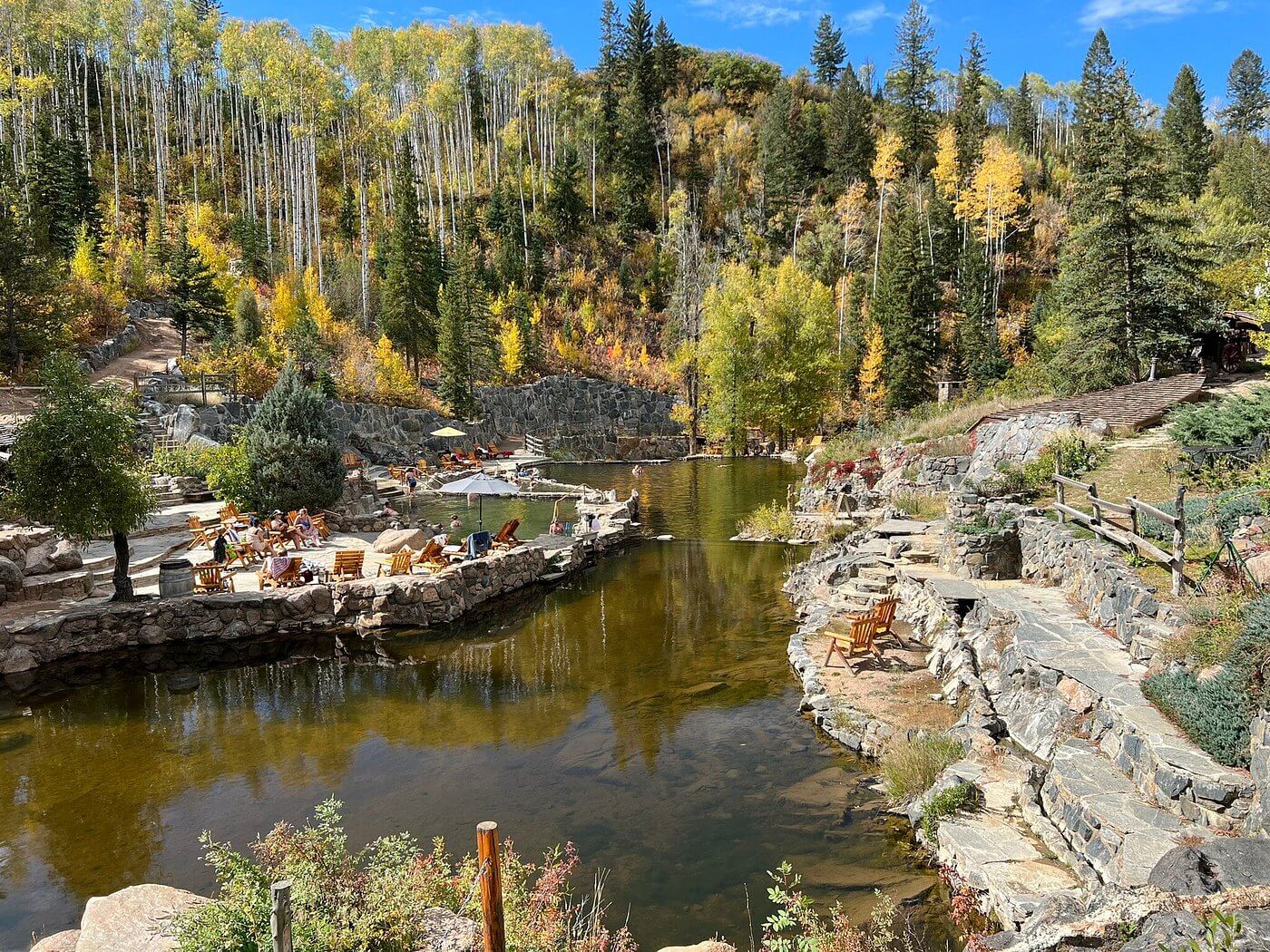 Natural hot spring pool in the western United States surrounded by mountains, illustrating the largest concentration of hot springs in North America
