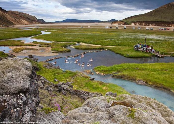 People soaking in Landmannalaugar Hot Spring near Hella, Iceland