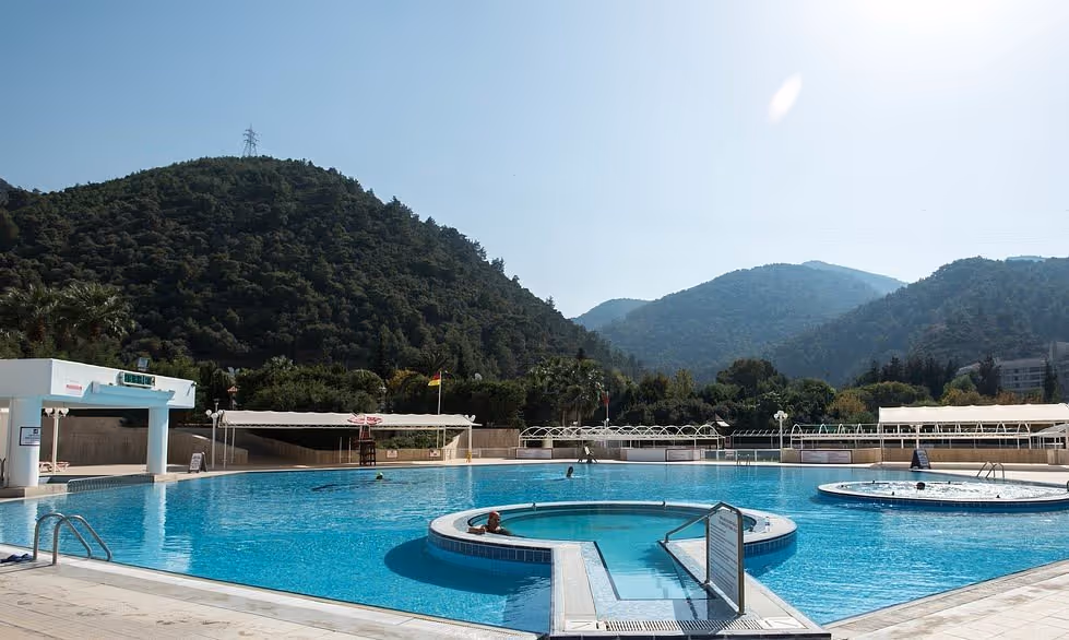 Outdoor thermal baths with mountain backdrop in Izmir, Turkey