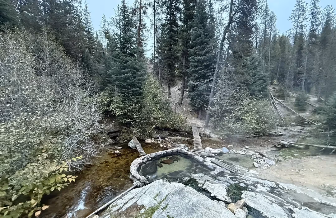 riverside hot spring in the forest in Trail Creek Hot Springs, Idaho