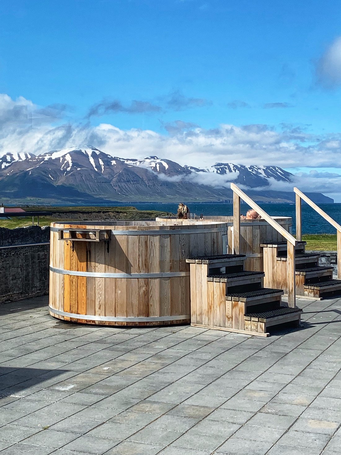 Hot tubs with mountain backdrop at Bjorbodin Spa in Iceland