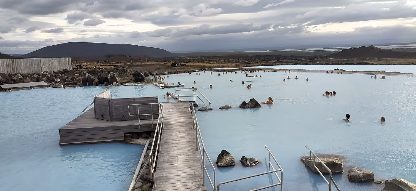 People soaking at geothermal baths at Earth Lagoon Myvatn