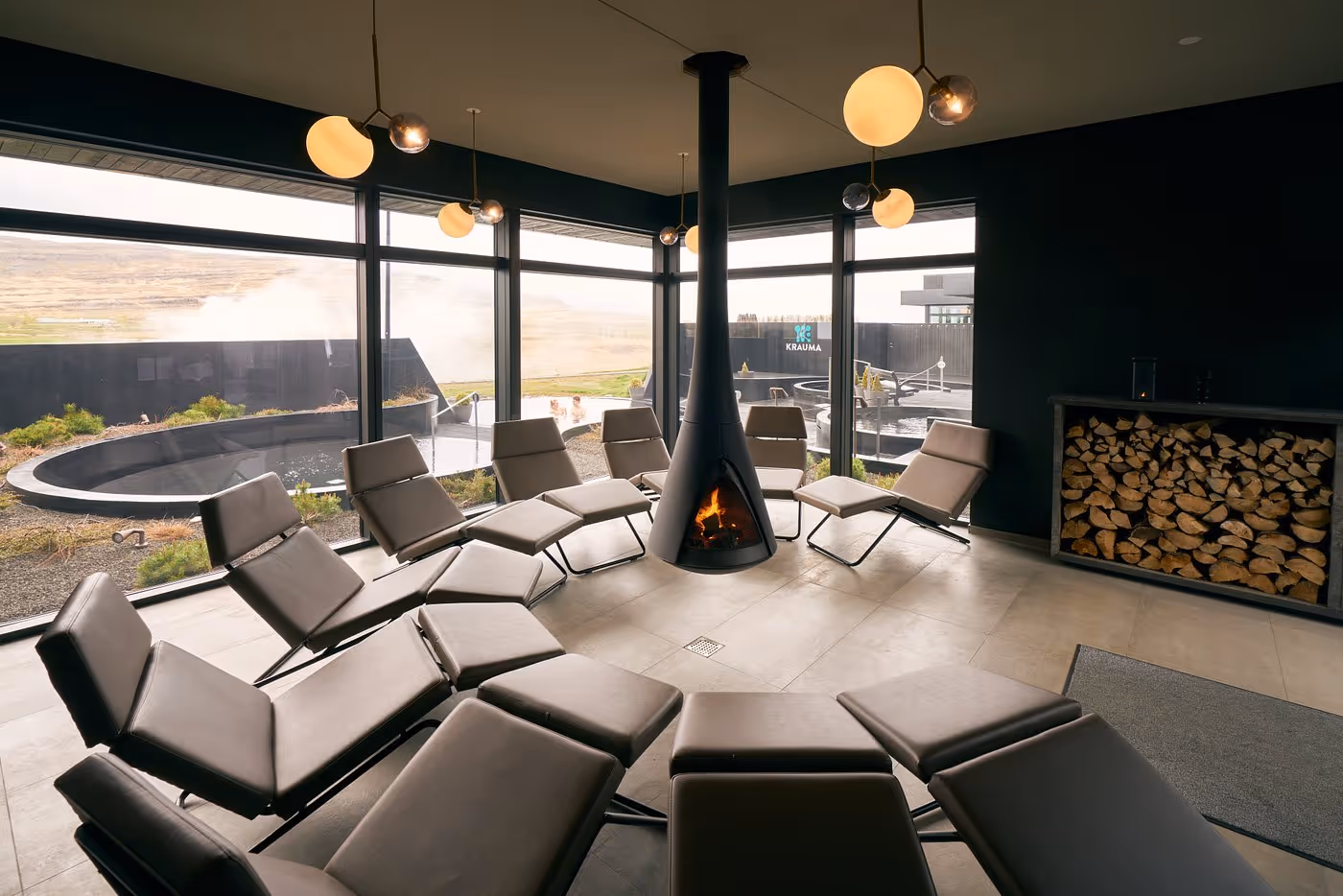 Relaxation room with a fireplace at Krauma Geothermal Baths near Reykholt, Iceland
