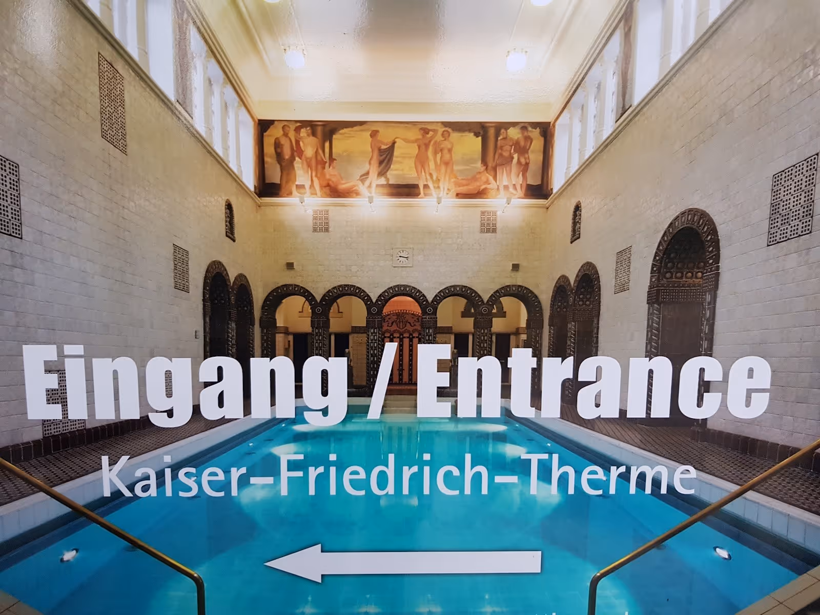 Wall detail featuring classical decorative columns and ornate ceramic insets at Kaiser-Friedrich-Therme in Wiesbaden Germany.