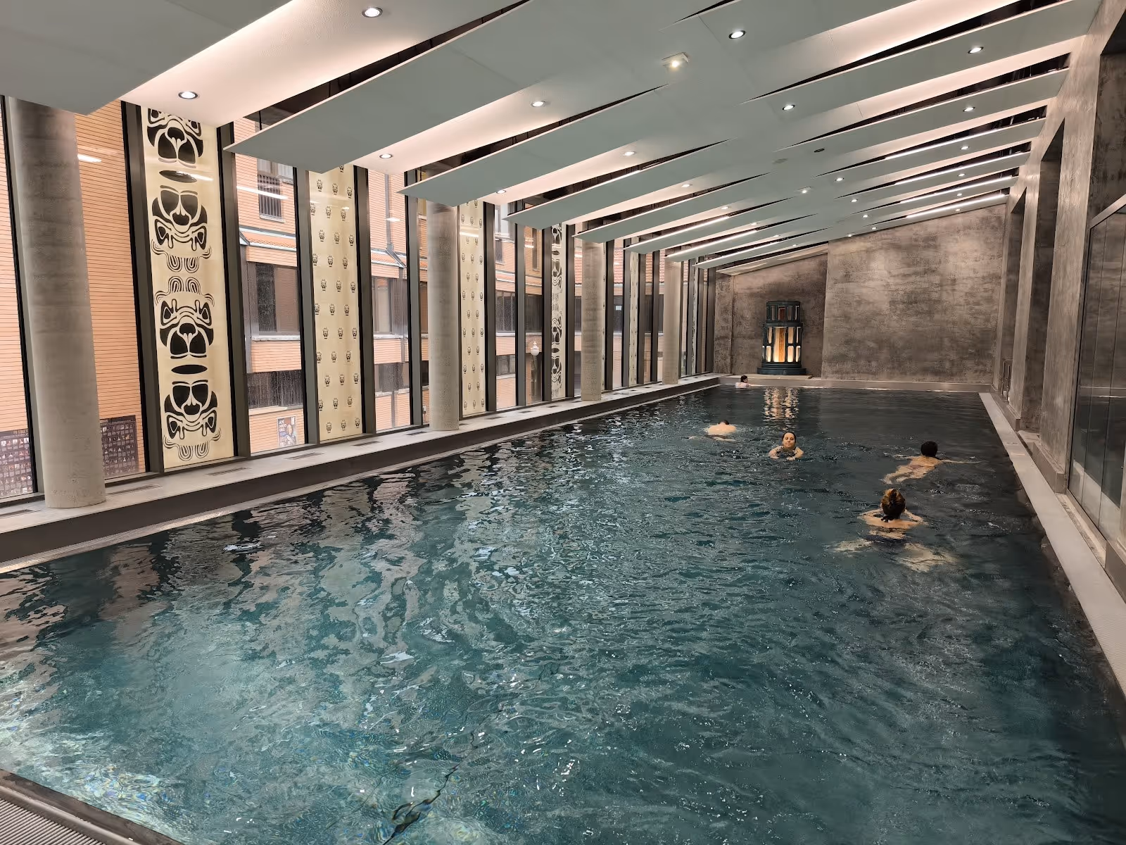 swimming pool inside spa building with a few people enjoying the water at imperial spa house near teplice in czechia.