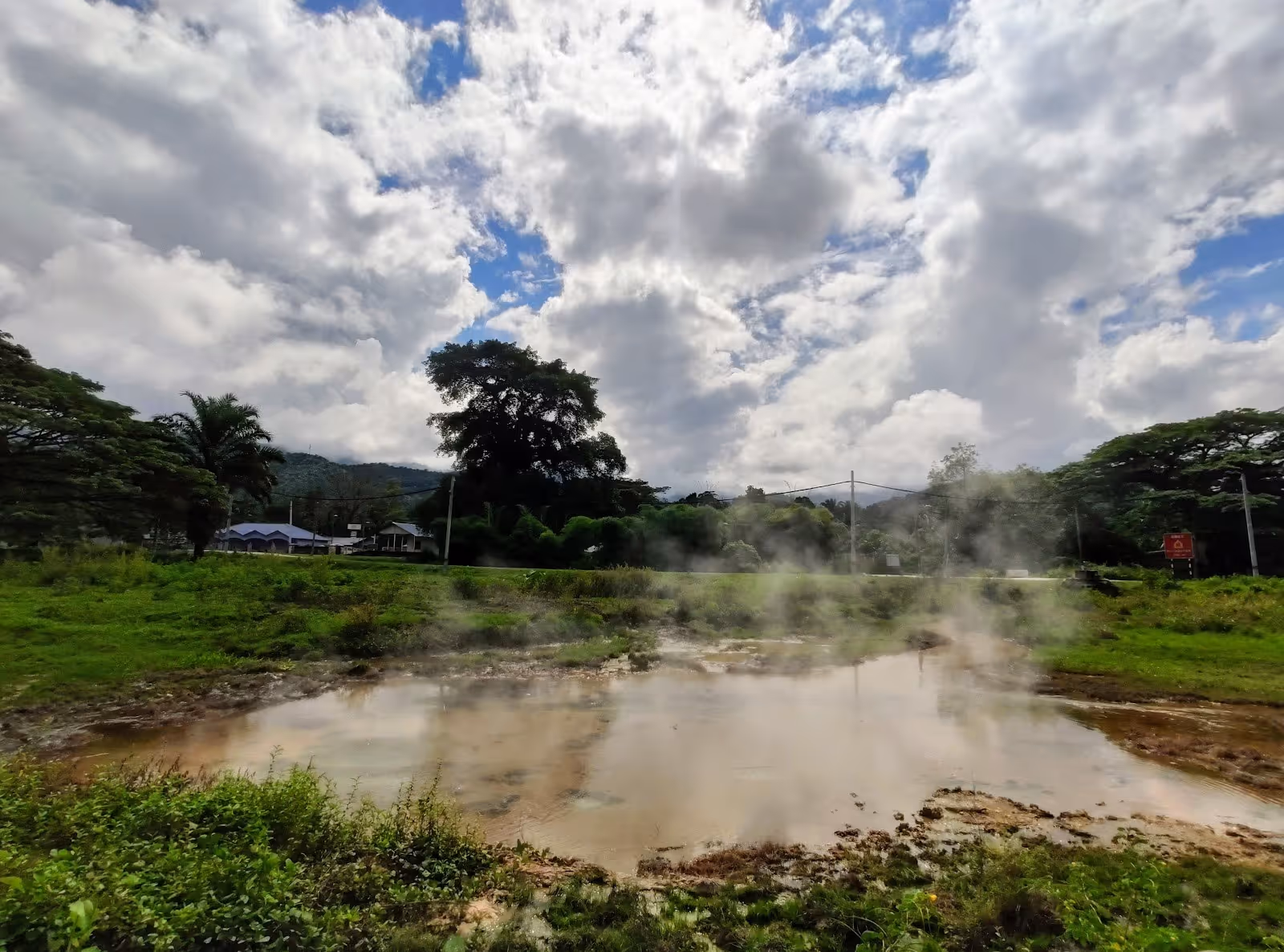 Ulu Slim Hot Spring Malaysia - steaming geothermal pool in forested Kampung Ulu Slim Perak