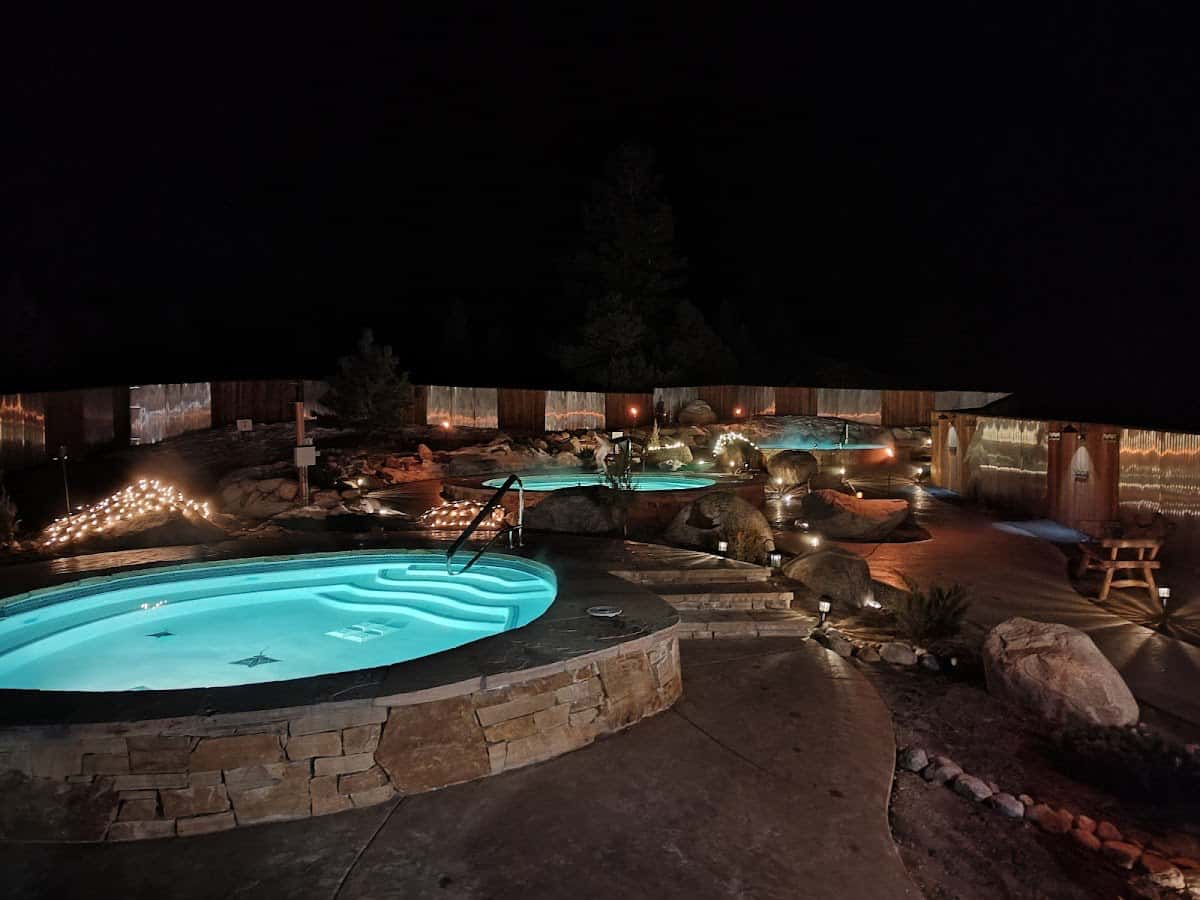 Charlotte Hot Springs, Colorado - three outdoor mineral pools with Collegiate Peaks in background