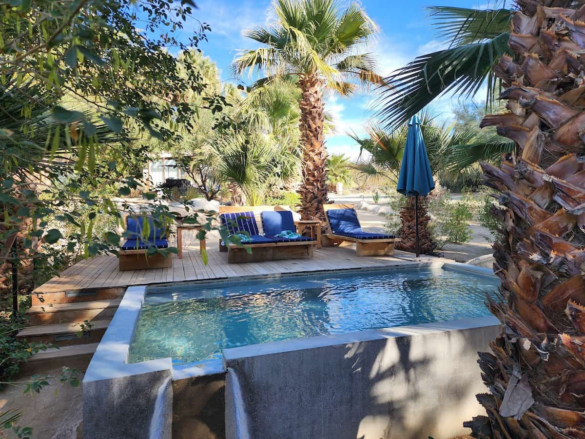 Two Bunch Palms, California - The Grotto mineral spring pool with palm trees in Desert Hot Springs