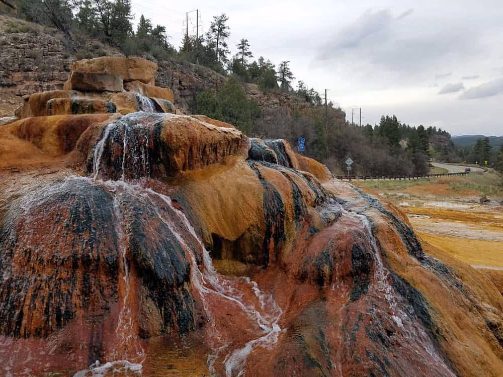 Pinkerton Hot Springs, Colorado - colorful mineral mound alongside US Highway 550