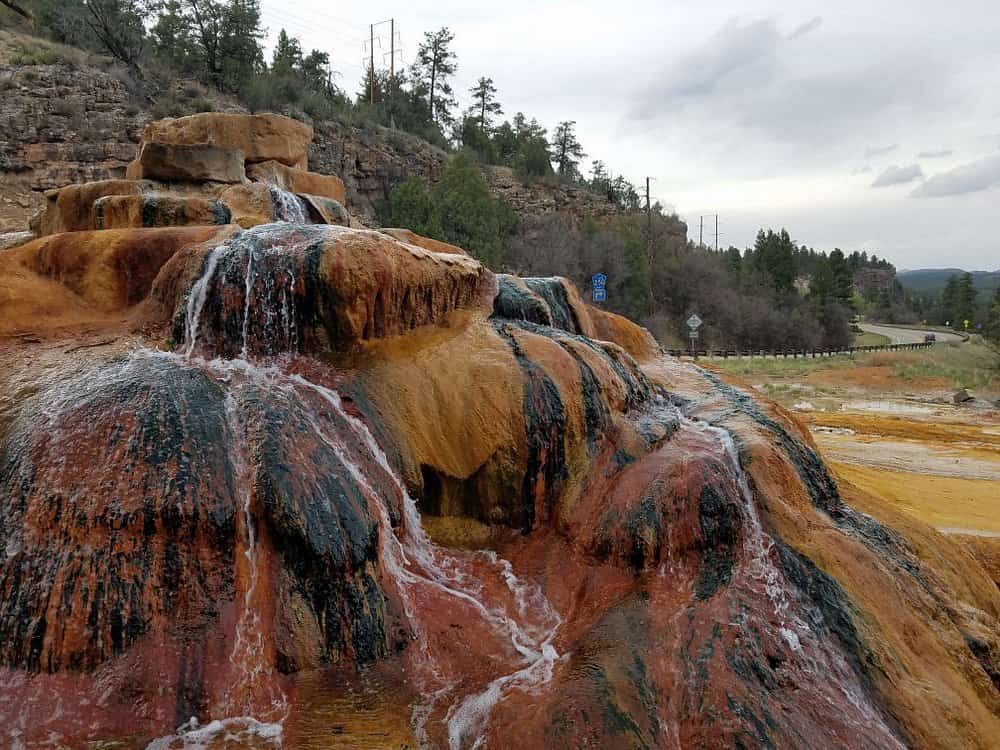 Pinkerton Hot Springs, Colorado - colorful mineral mound alongside US Highway 550