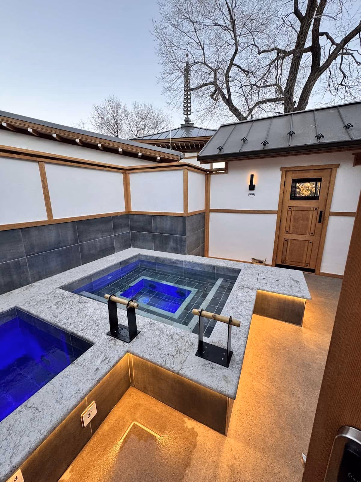 Ten Thousand Waves, New Mexico - outdoor hot tub suites on wooden decks in pinon and juniper forest
