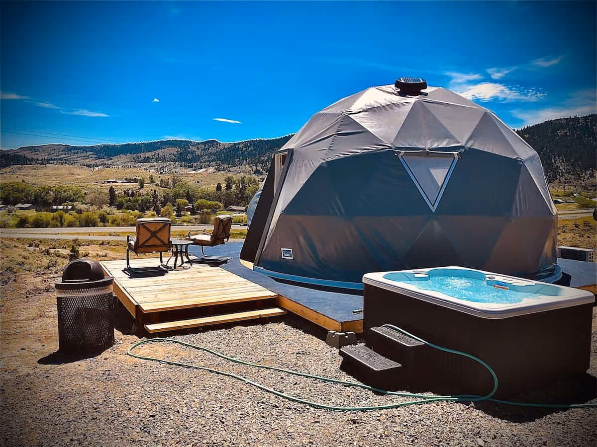 Pipestone Hot Springs, Montana - private outdoor hot spring tub at a glamping cabin near Whitehall