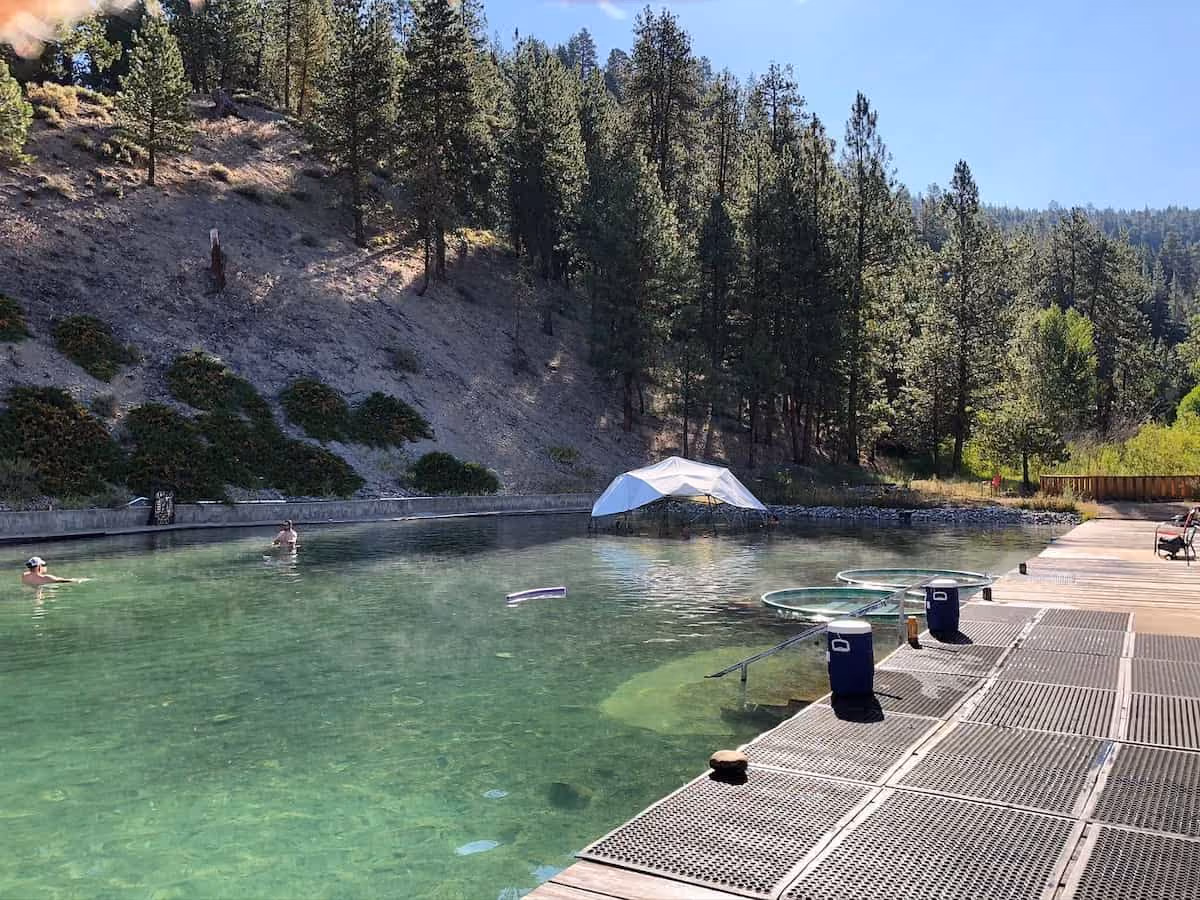 Trinity Hot Springs, Idaho - large outdoor geothermal pool with forested hills and resort