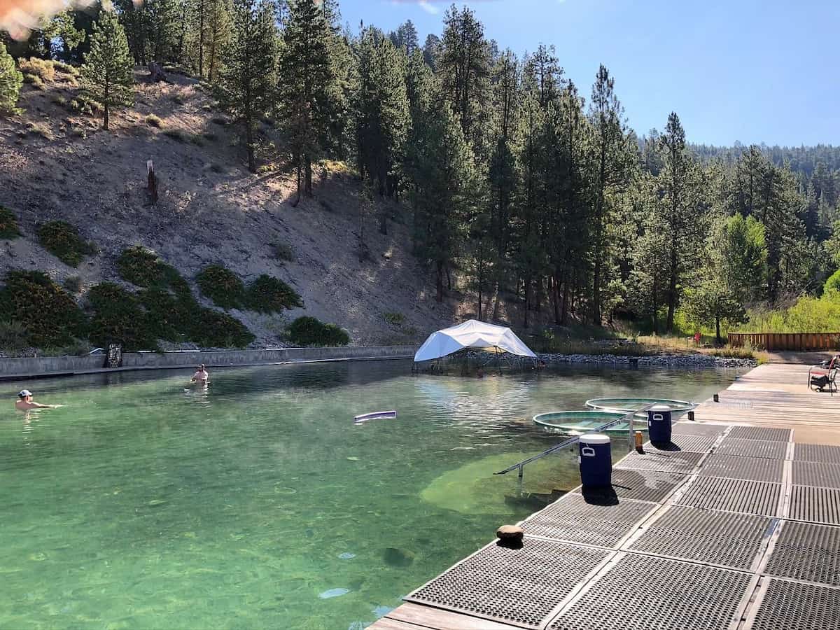 Trinity Hot Springs, Idaho - large outdoor geothermal pool with forested hills and resort