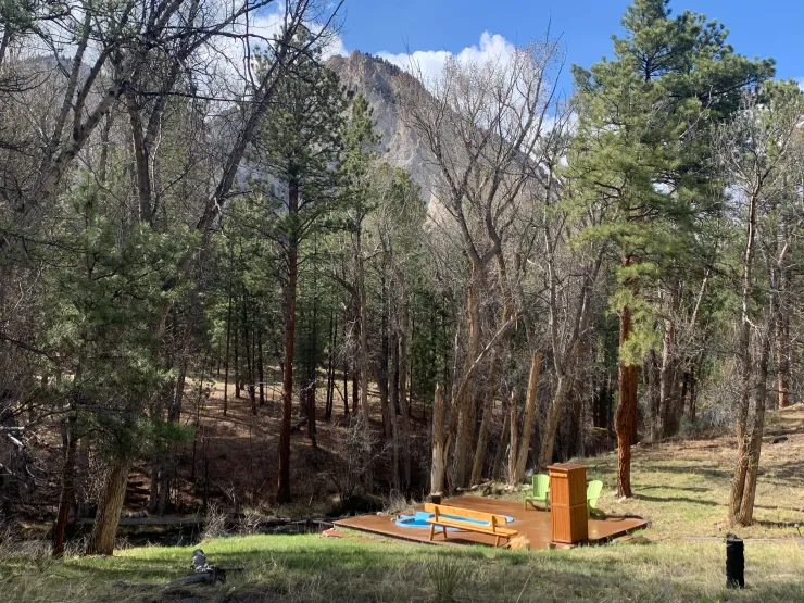private outdoor mineral pool beside Chalk Creek with mountain views at Aqua Hot Spring, Colorado