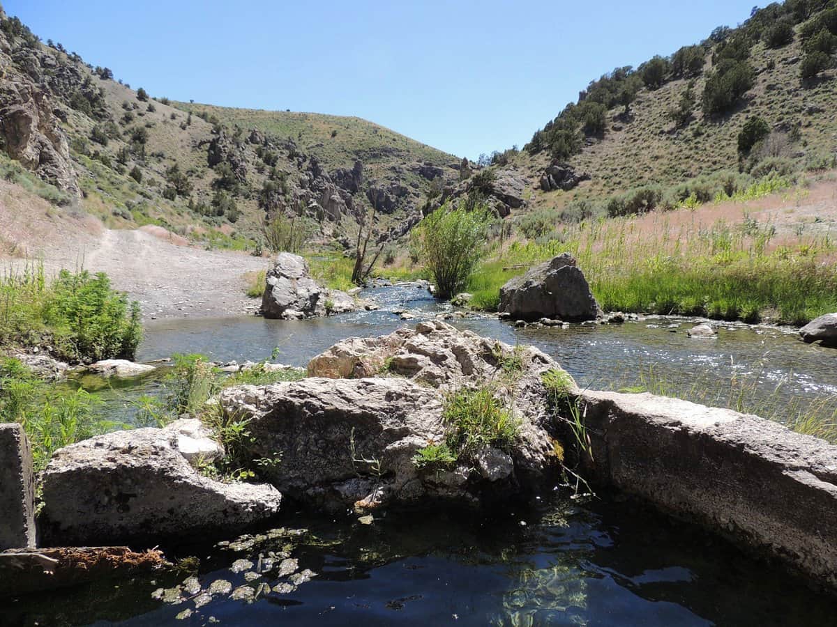Natural hot spring pool beside bishop creek in a desert canyon at twelvemile hot springs, Nevada